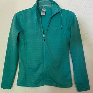 The North Face teal zip up.